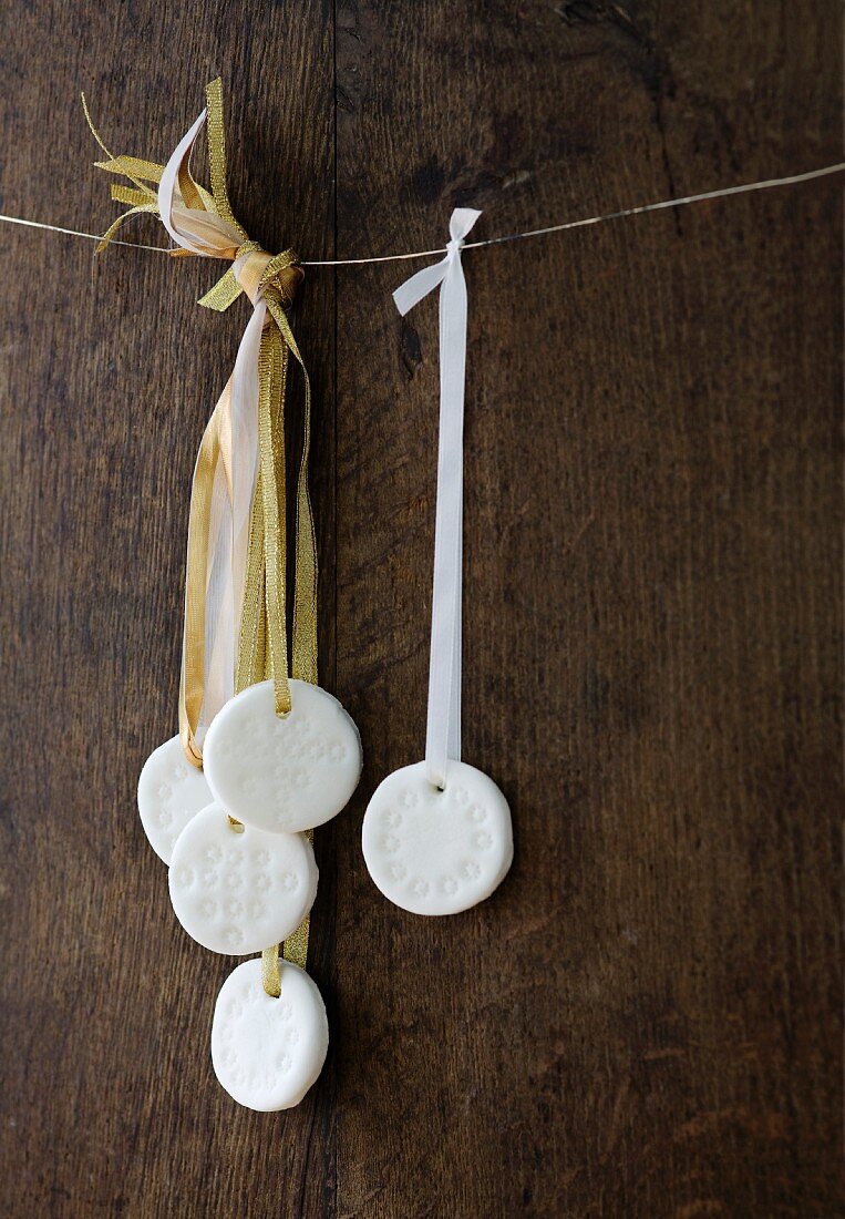Homemade peppermint creams hanging from strings