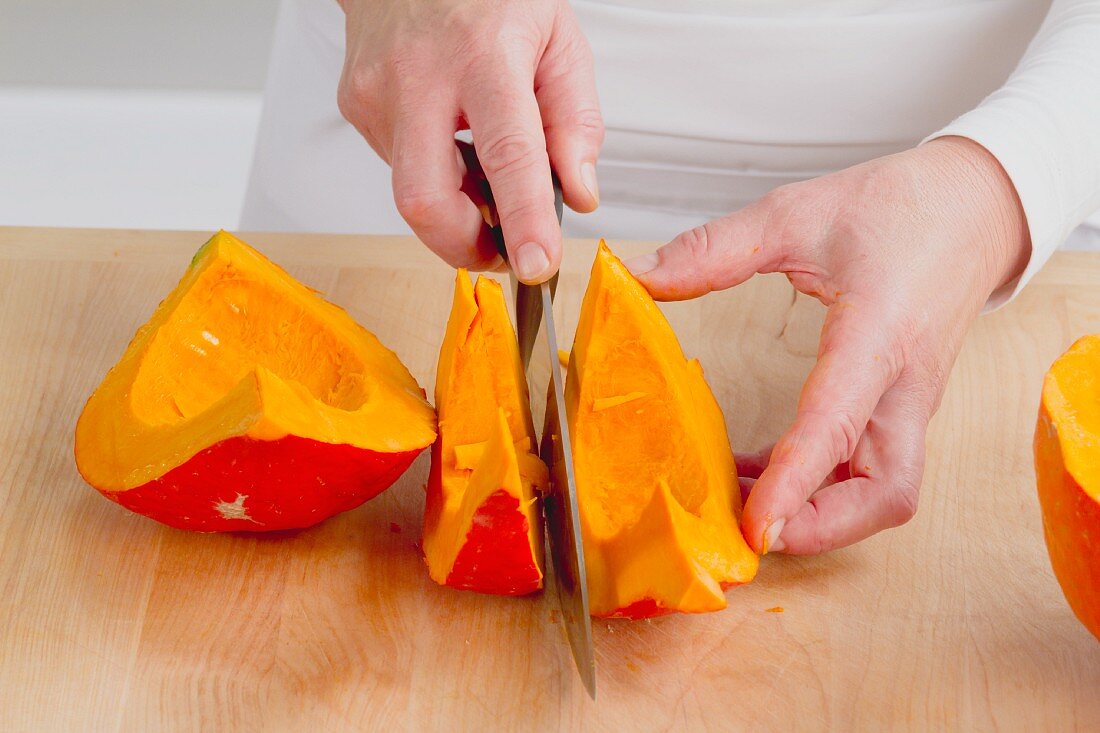 Hokkaido pumpkin being sliced