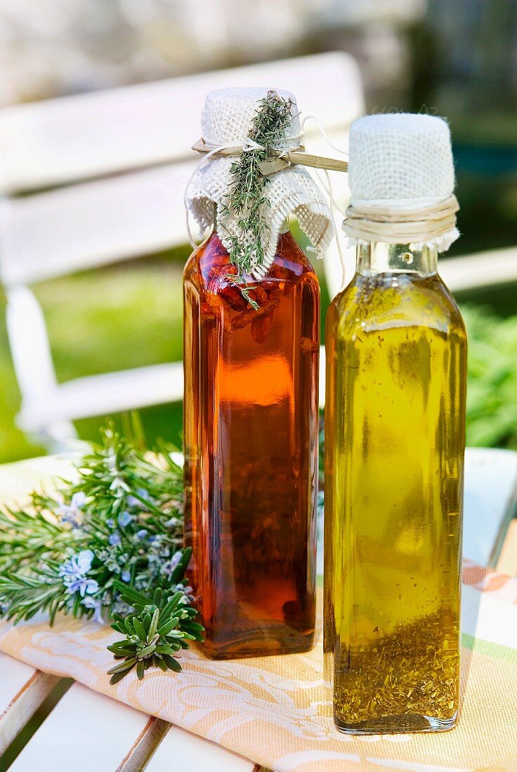 Vinegar and oil in bottles on a table outside