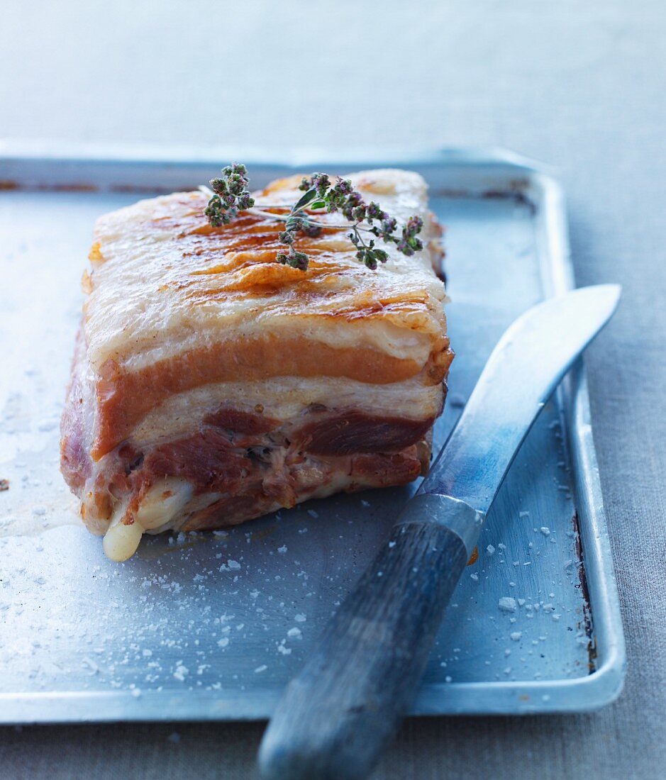 Roast pork ribs on a baking tray