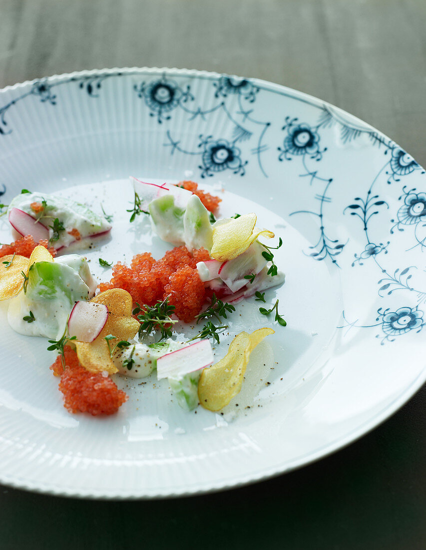 A plate of vegetables with lumpfish roe