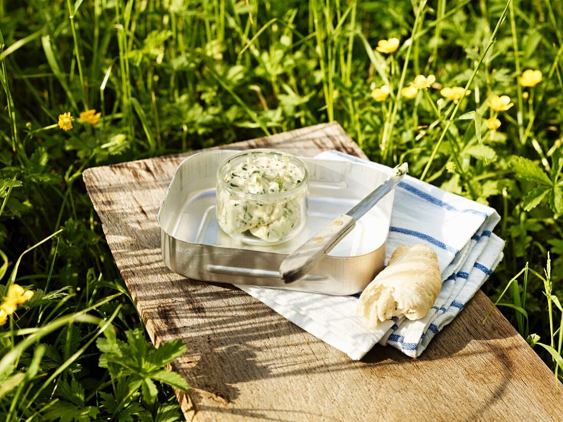 Herb butter and bread for a picnic