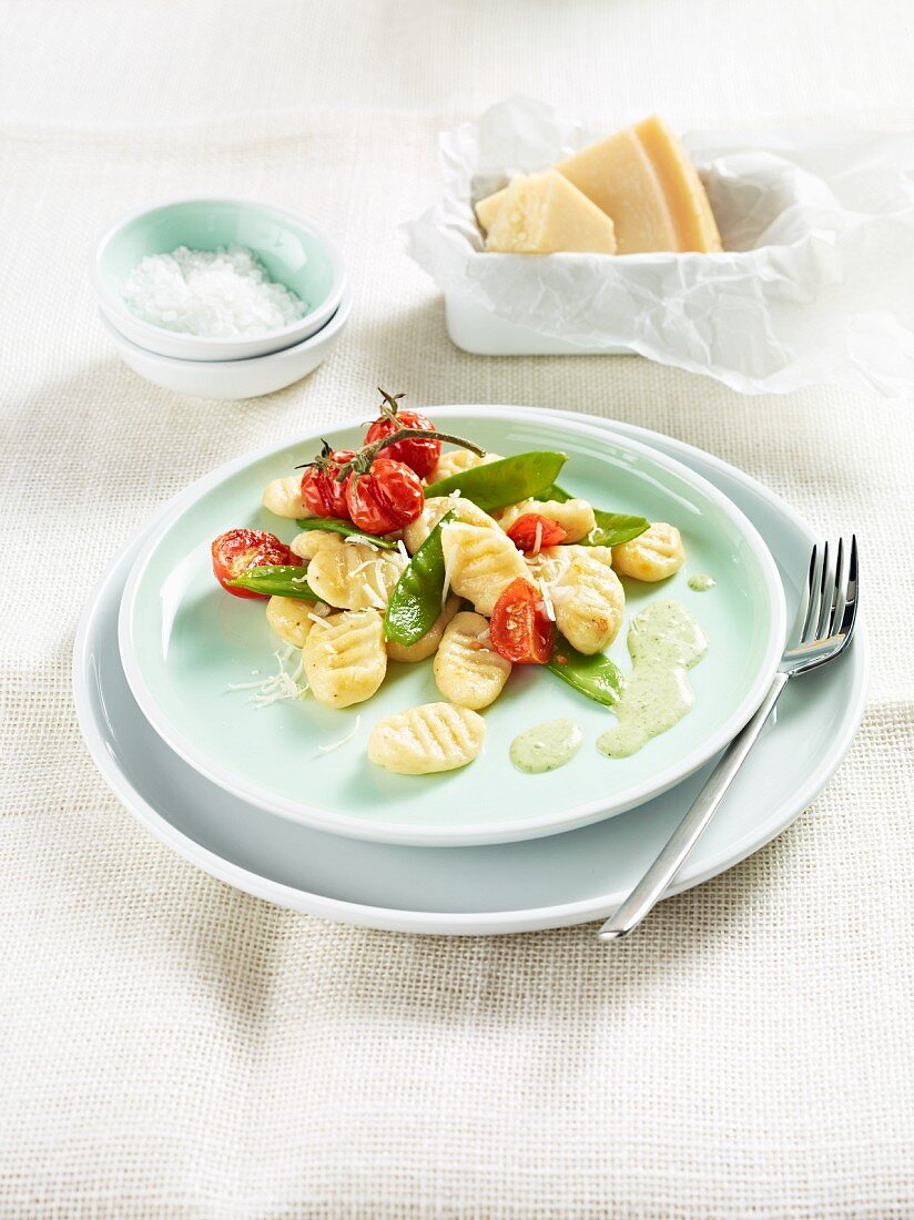Spelt ricotta gnocchi with tomatoes and mange tout
