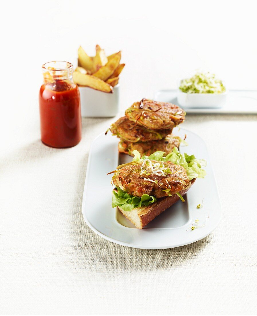 Veggie burgers with potato wedges and homemade ketchup