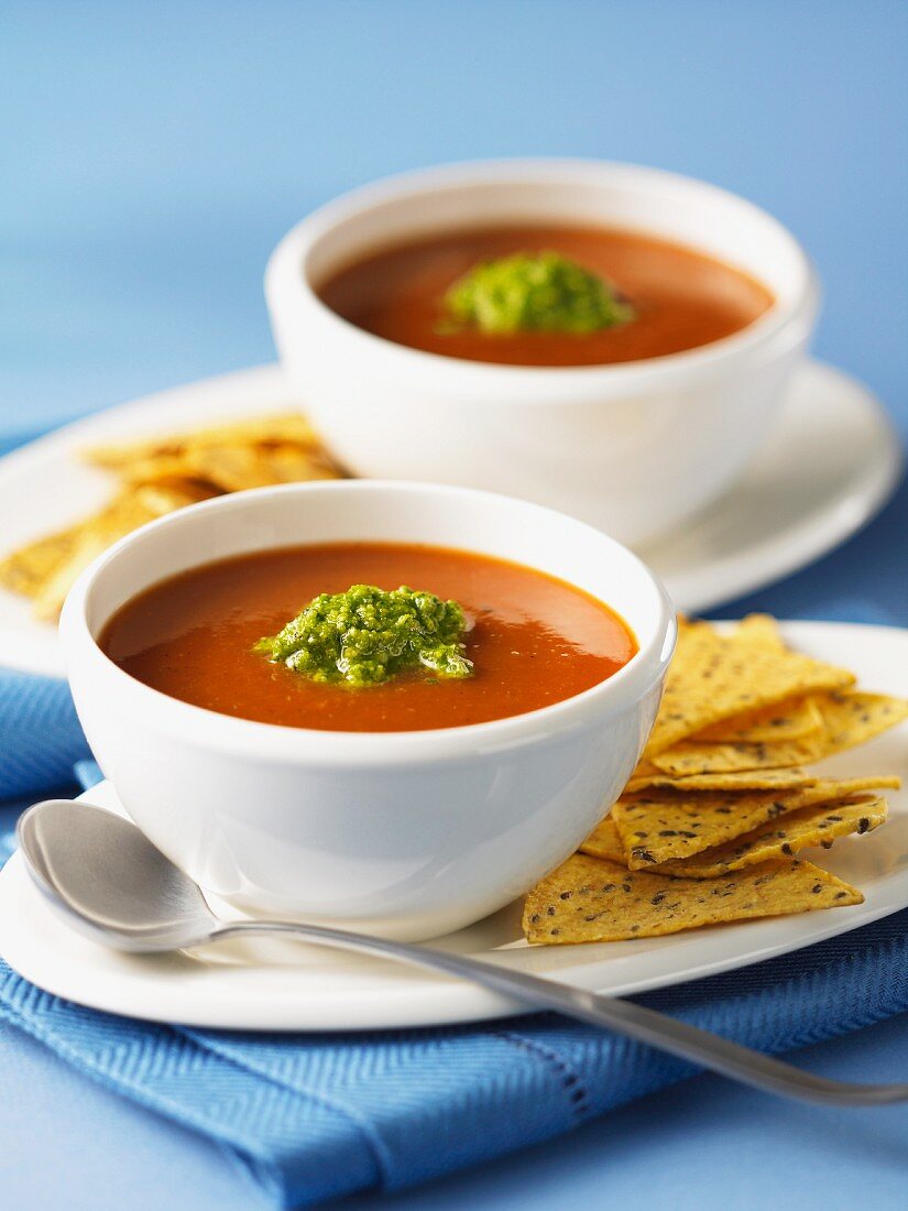 Tomato soup with guacamole and tortilla chips