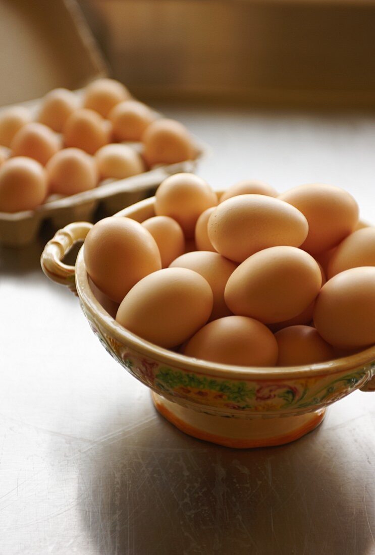 Fresh Eggs in Decorative Bowl; Eggs in Carton