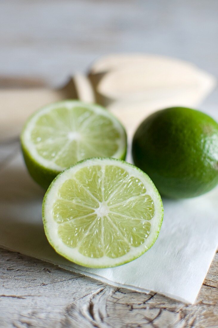 Whole and halved limes