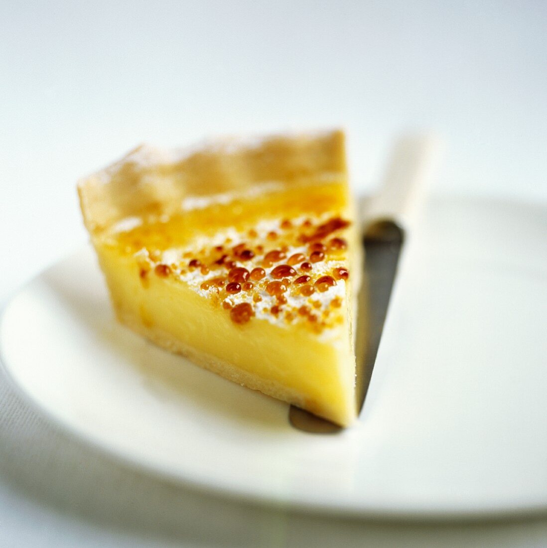 A slice of caramelised lemon tart