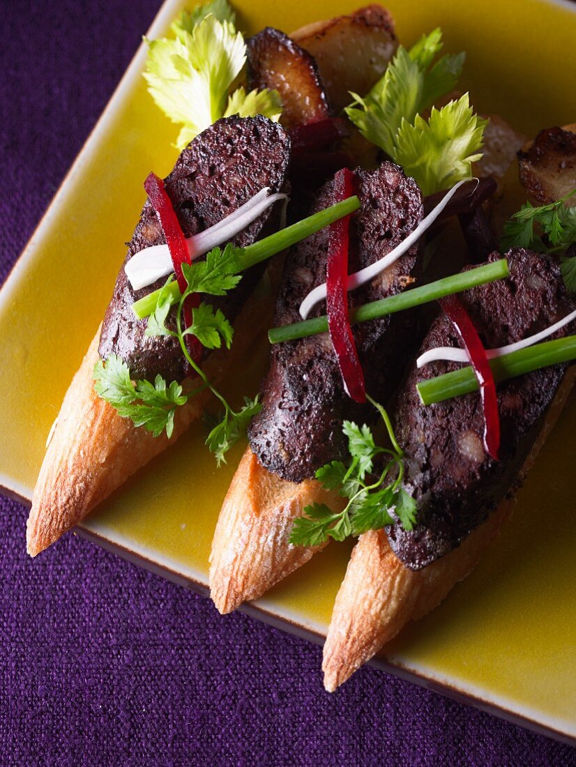 Crostini topped with black pudding