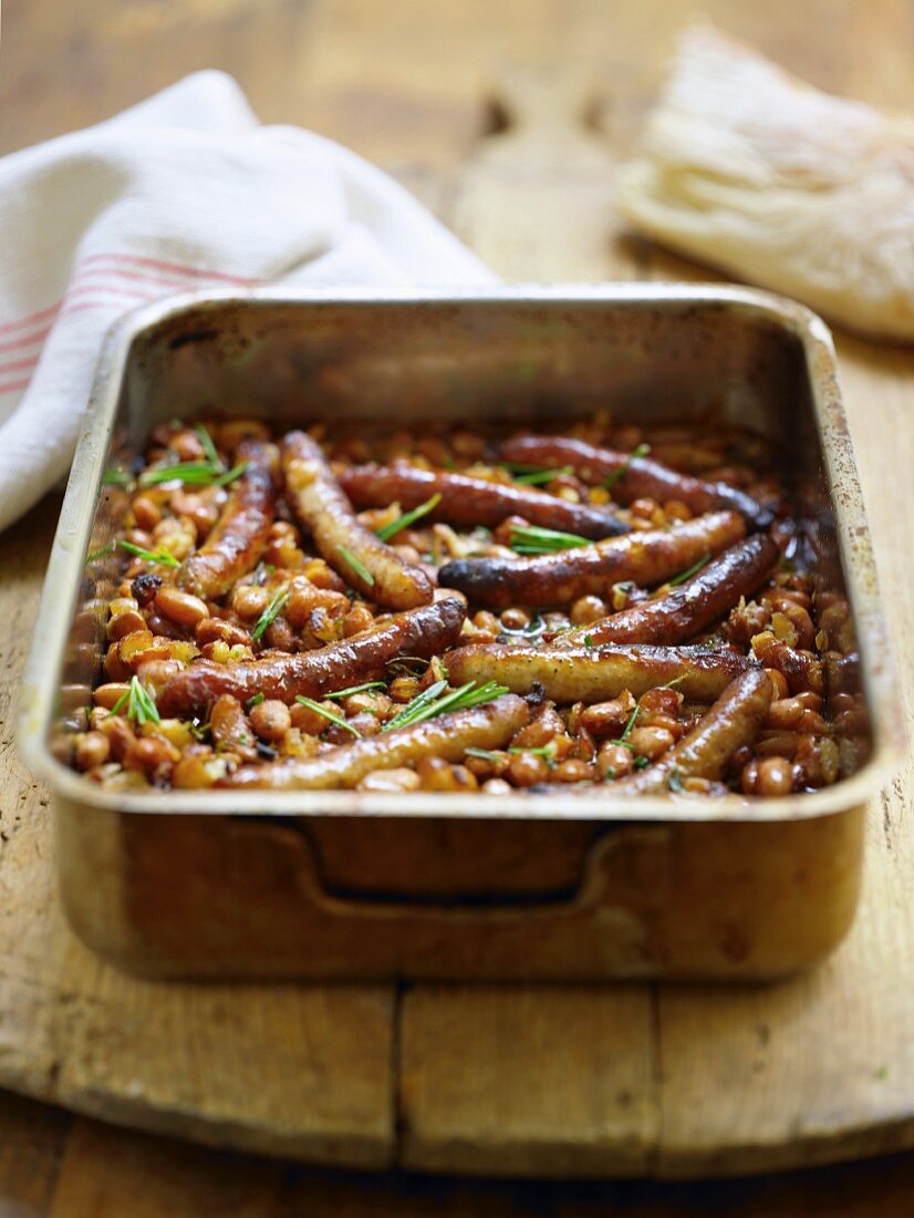 Bean bake with sausages and rosemary