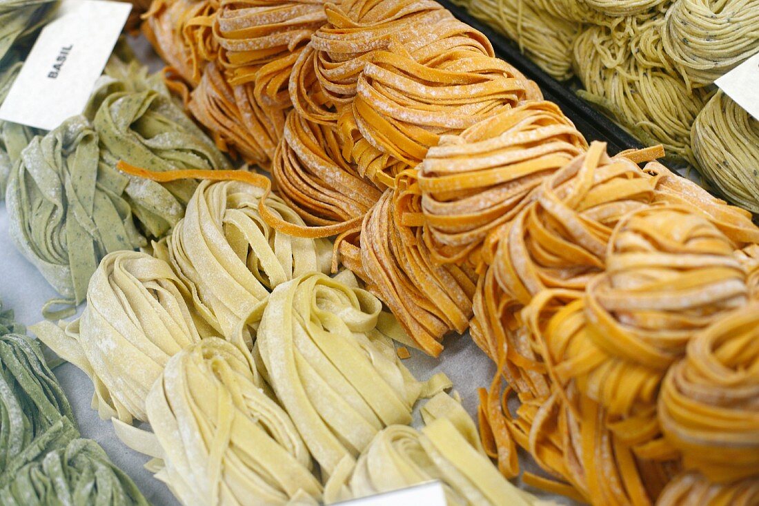 Assorted Flavored Fresh Ribbon Pasta at a Market