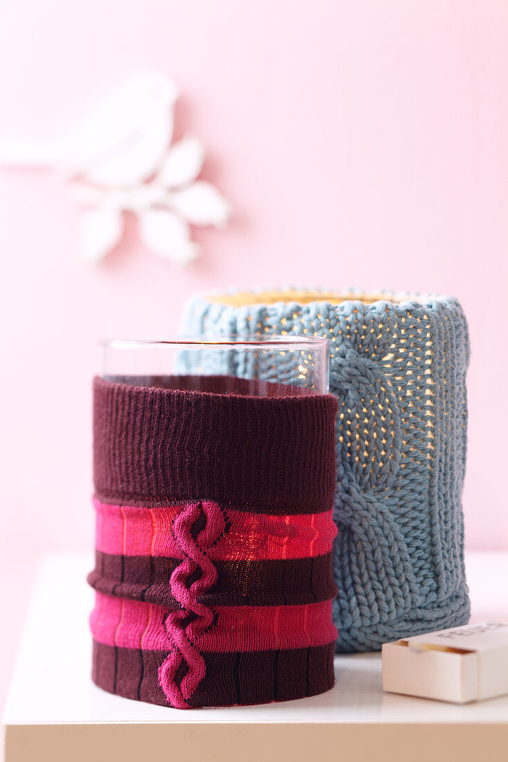 Candle holders with knitted covers