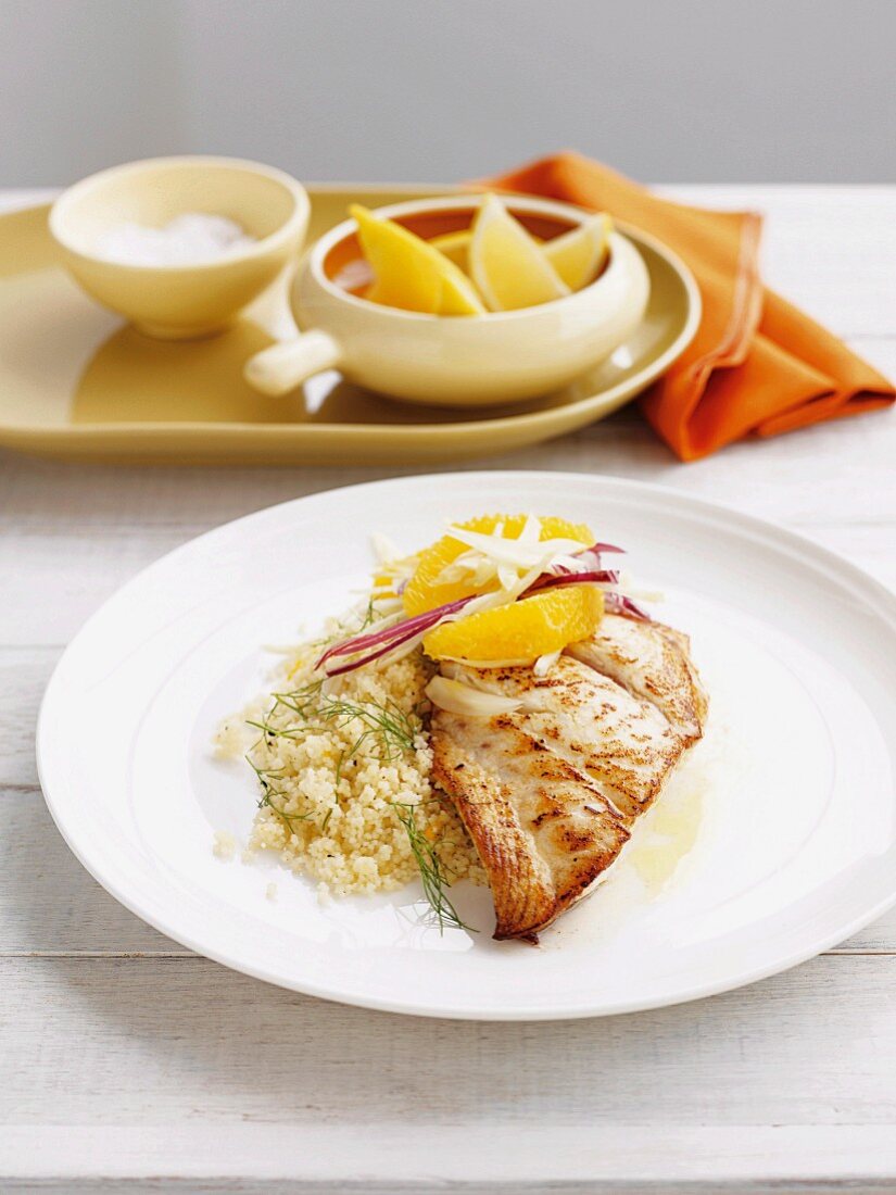 Fried fish with fennel, oranges and couscous