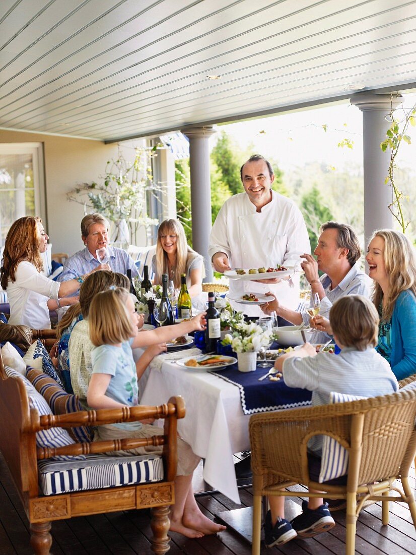 A family celebration on a covered terrace