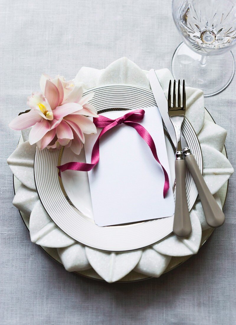 A table setting decorated flowers