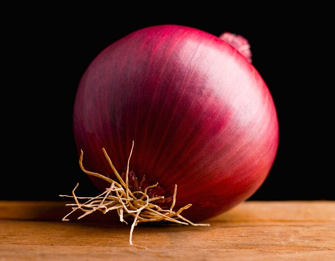 Red Onion on a Wooden Surface