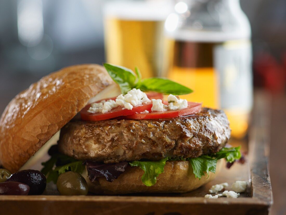 Pesto Turkey Burger with Feta Cheese, Tomato, Lettuce and Olives; With Beer