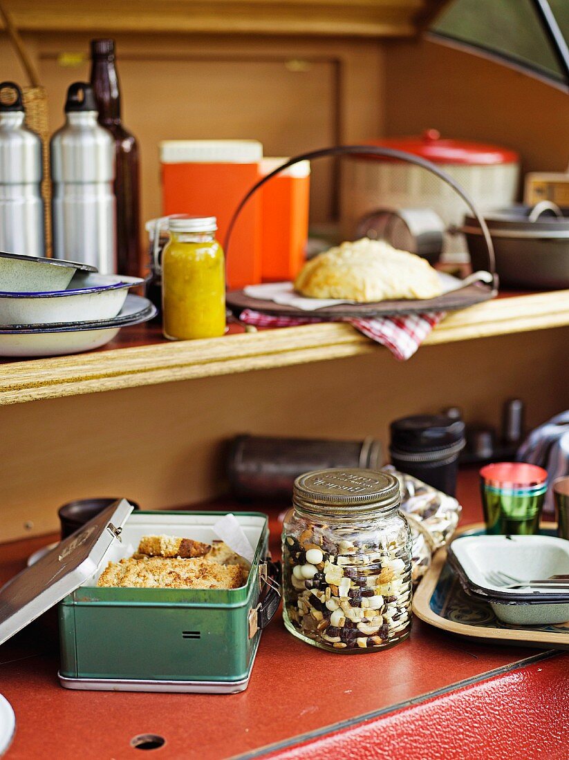 Kitchen utensils on a shelf in a caravan