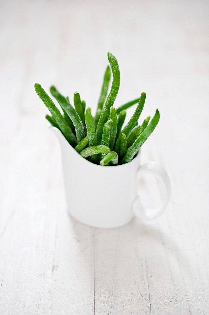Frozen green beans in a cup