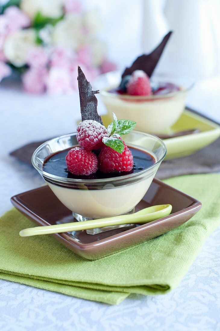 Bavarian cream with chocolate sauce and raspberries