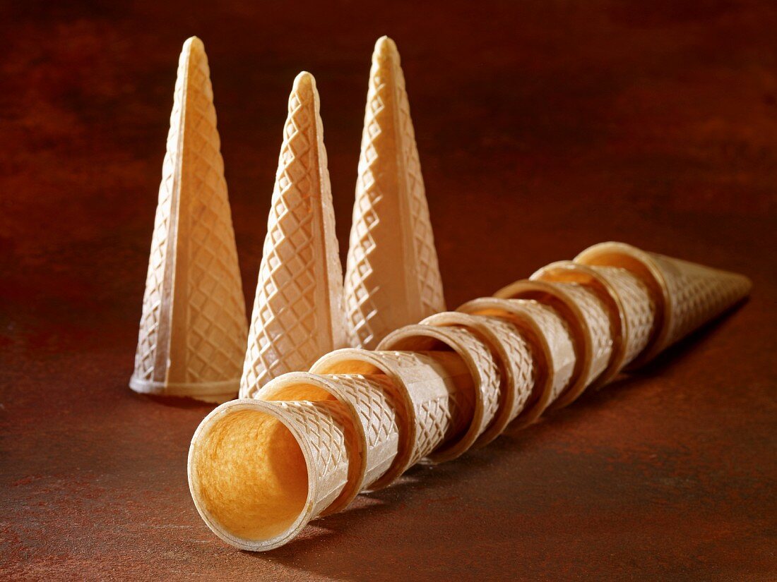 Ice cream cones, standing and stacked and lying