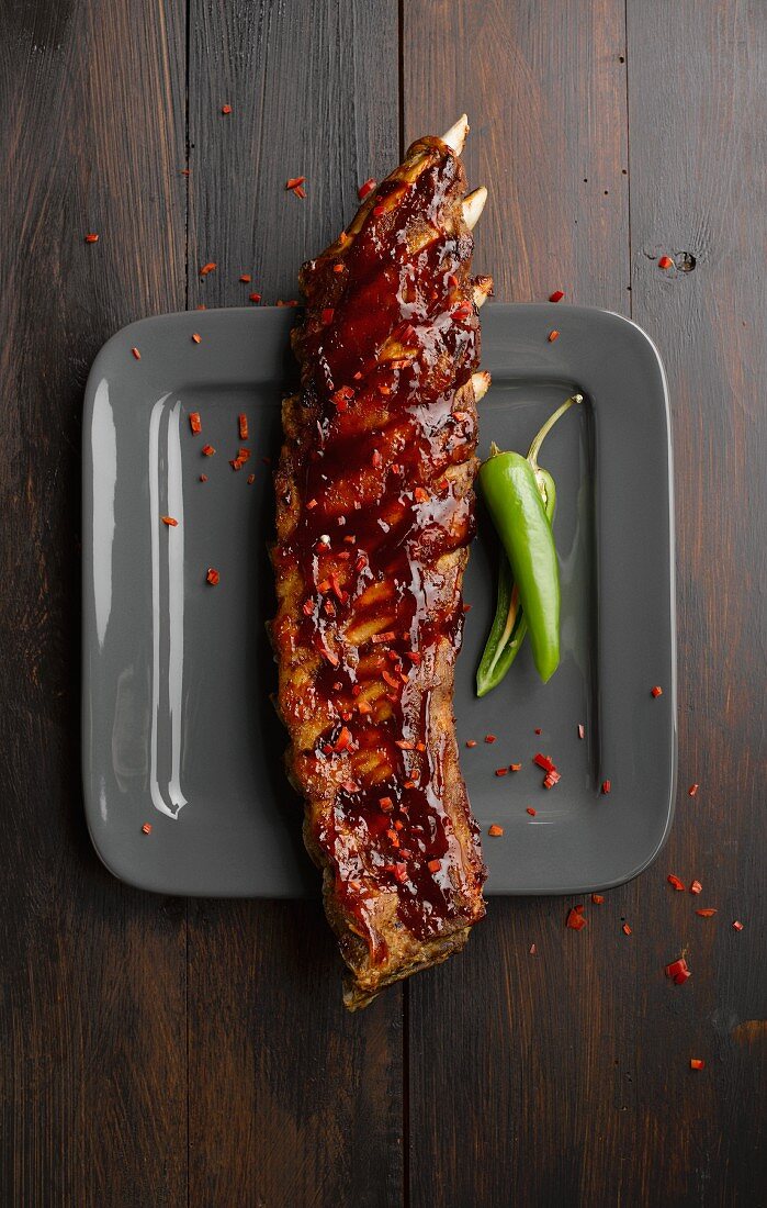 Spare ribs with chilli peppers on a plate