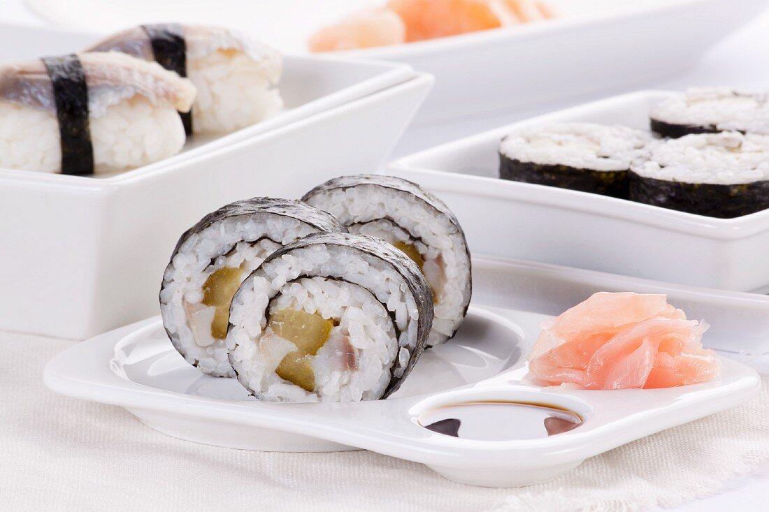 Maki and nigiri sushi with herring and gherkins
