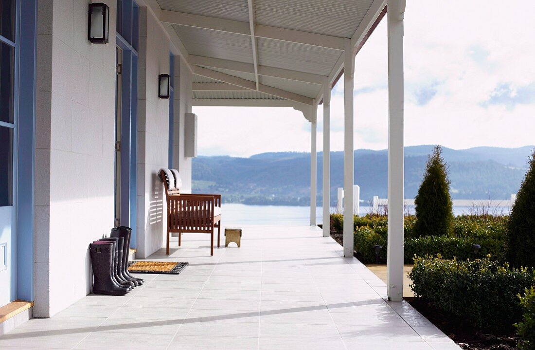 Wooden house with veranda and view of mountain landscape