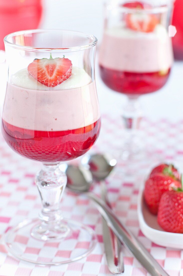 Vanilla and strawberry mousse in dessert glasses