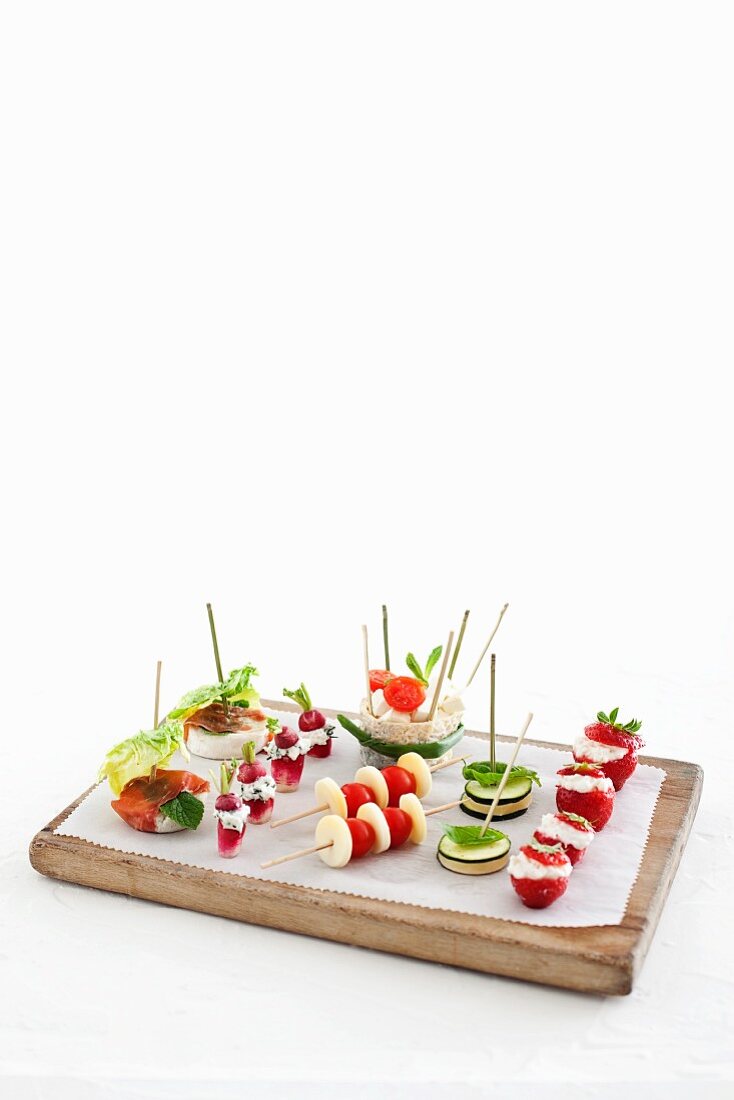 Various canapes on a chopping board