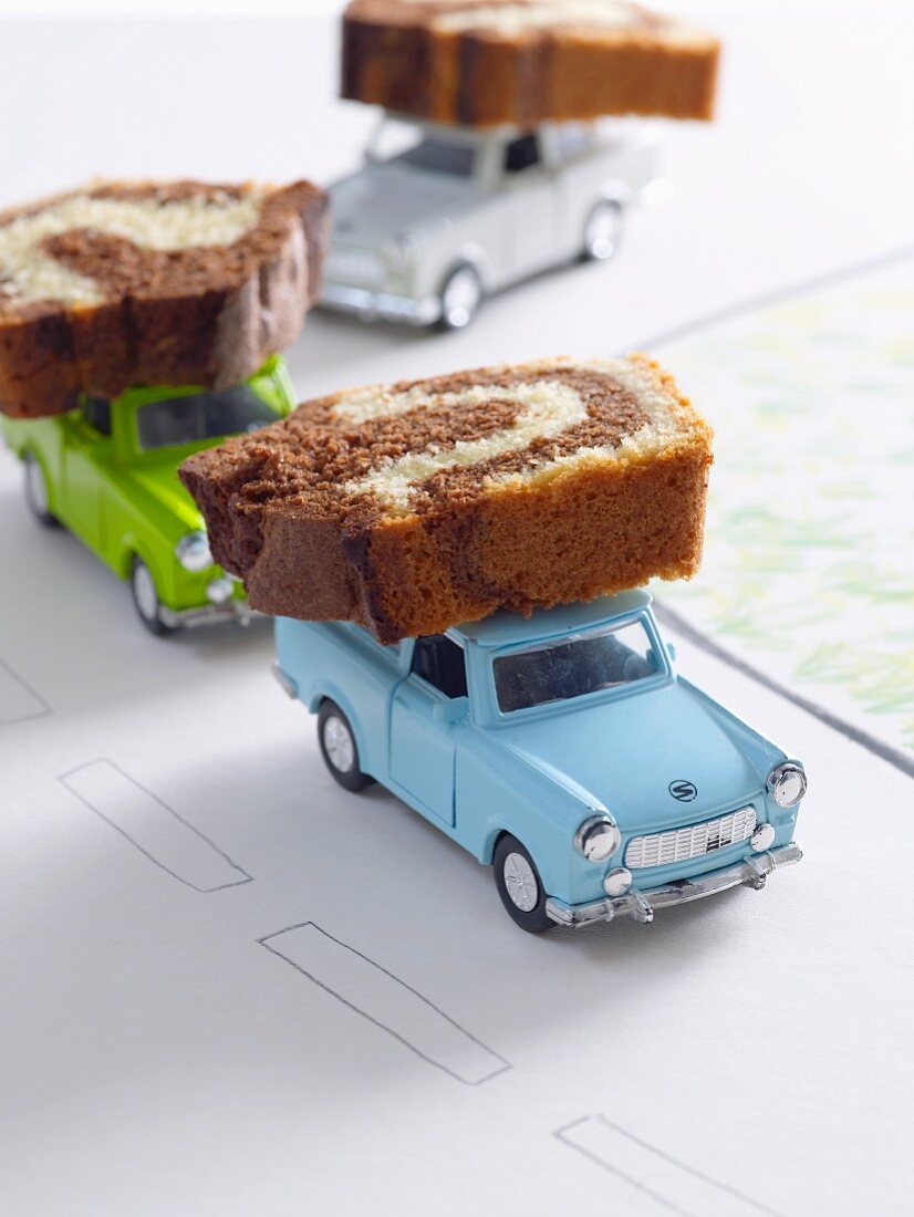 Slices of marble cake on toy cars
