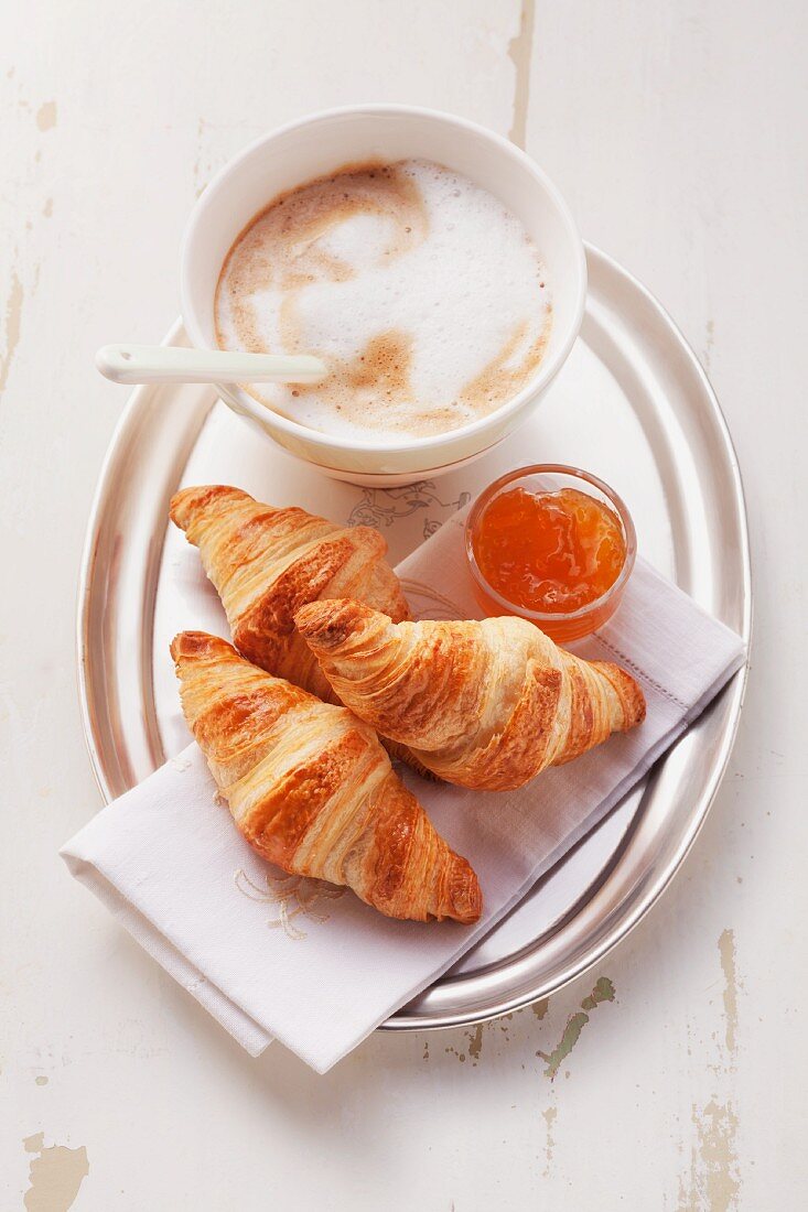 Croissant with marmalade and cafe au lait