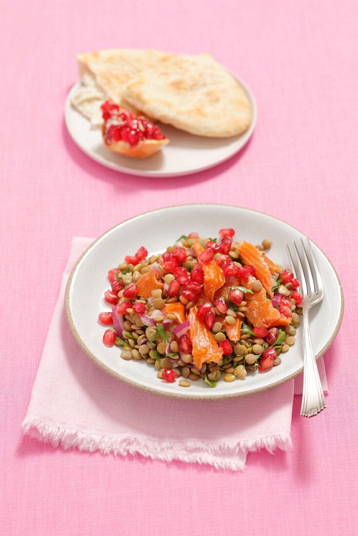 Lentil salad with pomegranate and hot smoked salmon