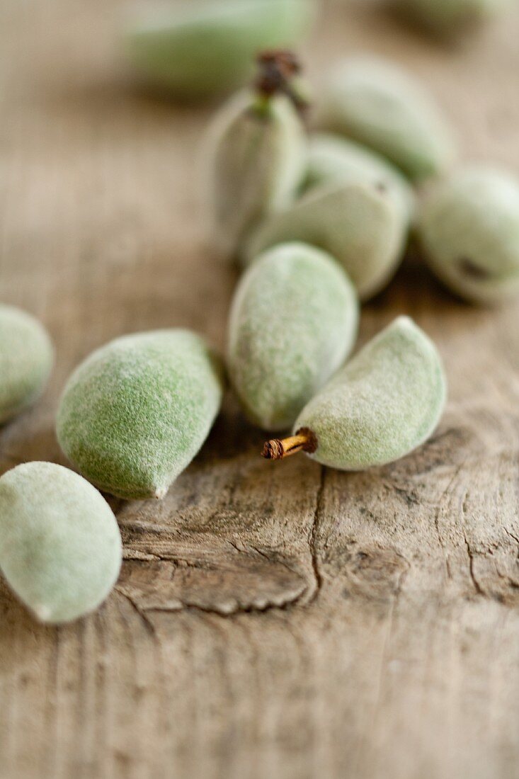 Fresh almonds on a wooden surface