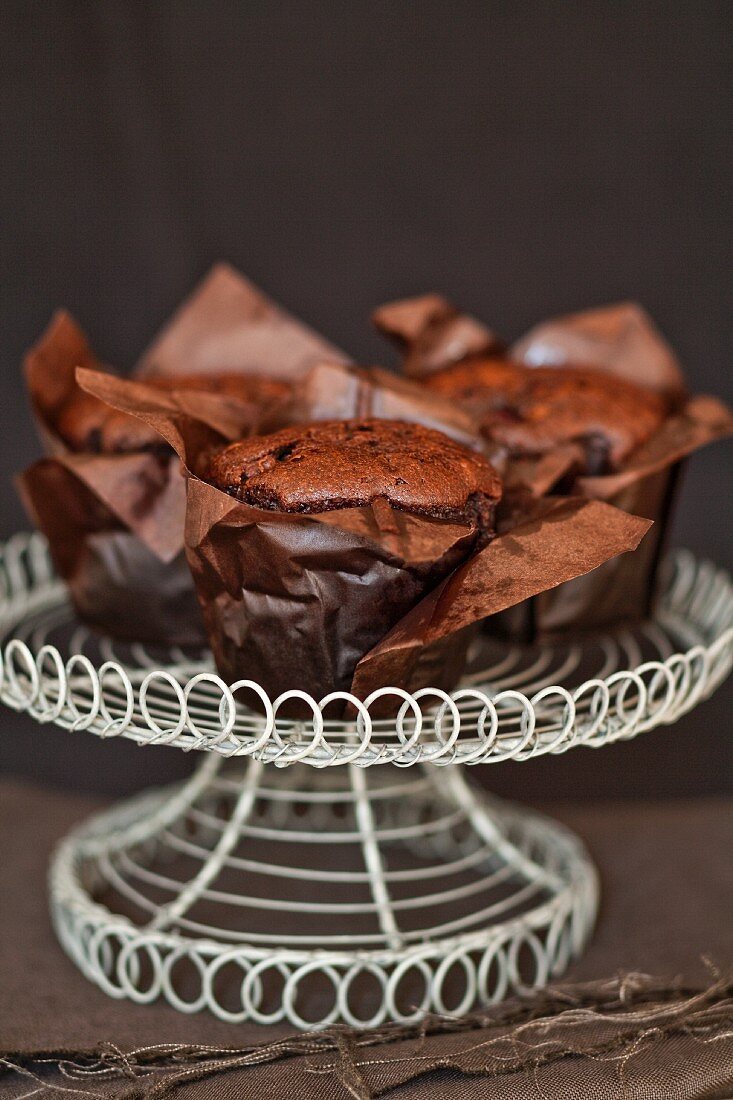 Chocolate muffins on a cake stand