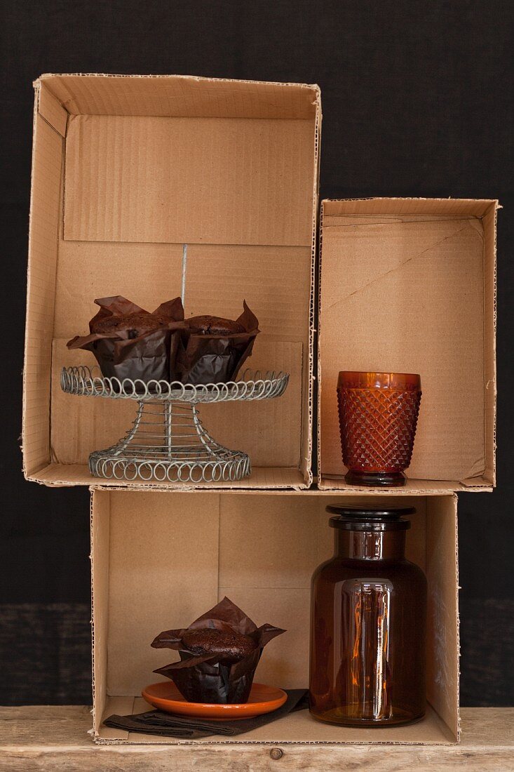 Chocolate cake displayed in cardboard boxes