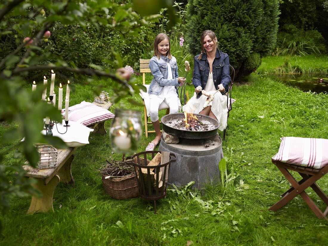 A mother and daughter having a barbecue