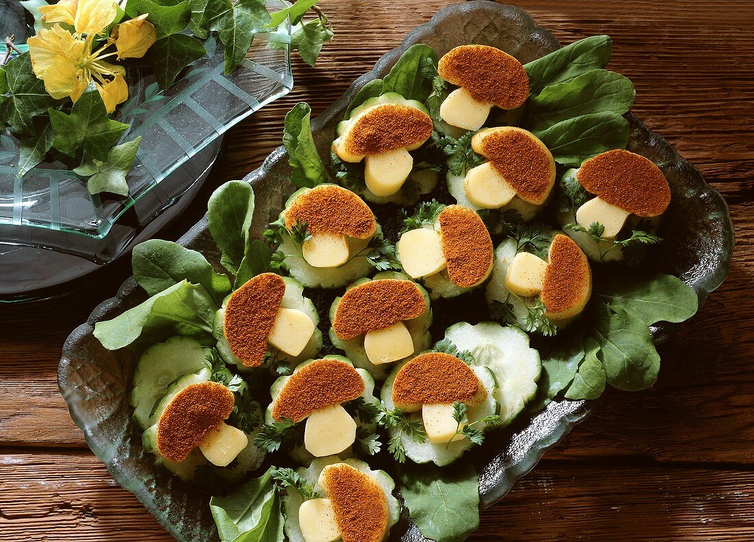 Mushroom-shaped Cheese Slices with Paprika on Cucumber Slices