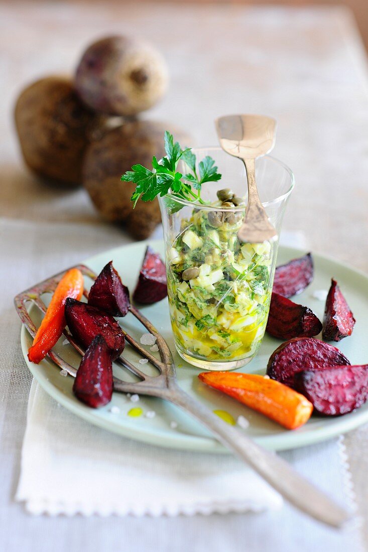 Baked beetroot and carrots with an egg and caper salad