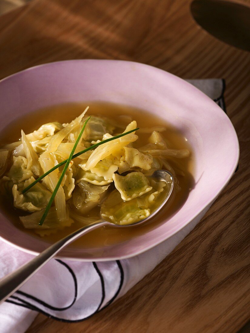 Clear broth with fennel and ravioli