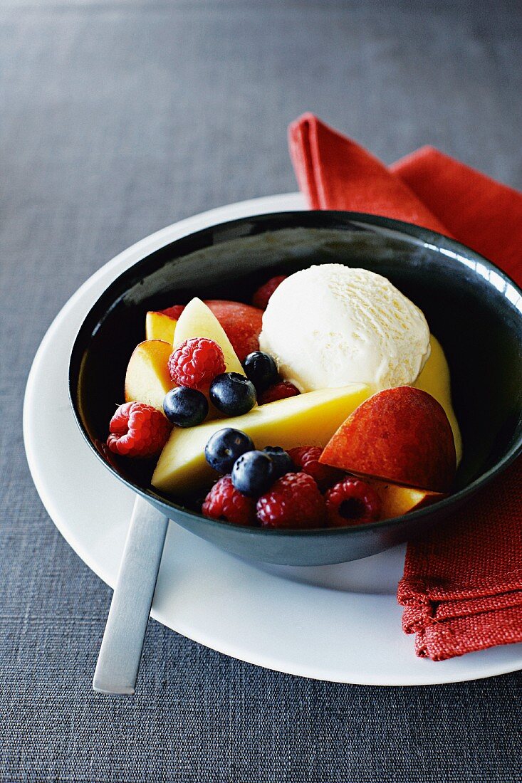 Fresh fruit with vanilla ice cream