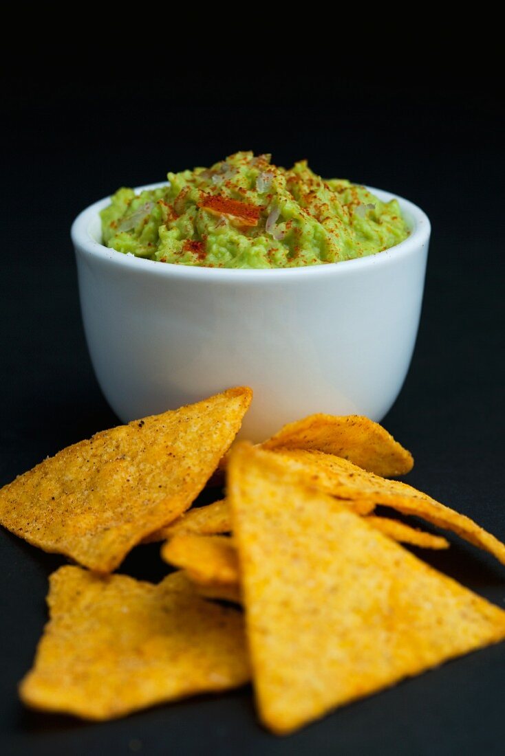 Bowl of Homemade Guacamole; Tortilla Chips