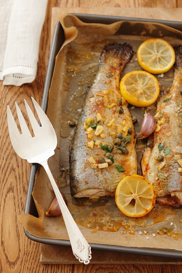 Trout with capers, garlic and lemons