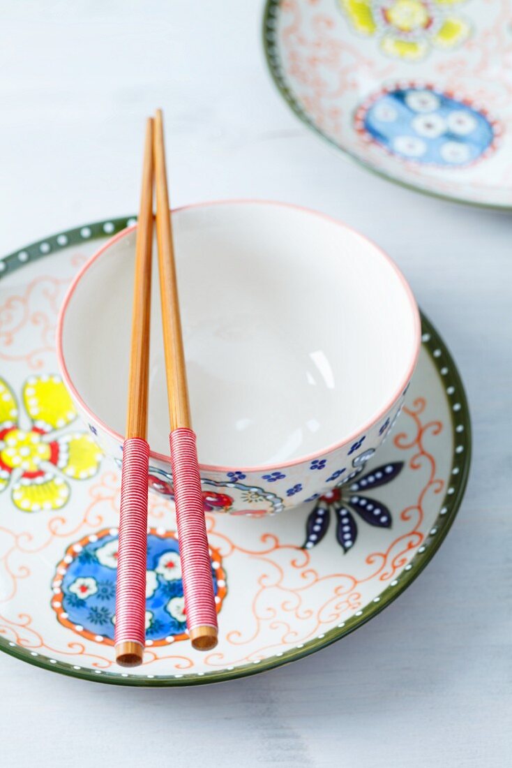 Oriental crockery with chopsticks