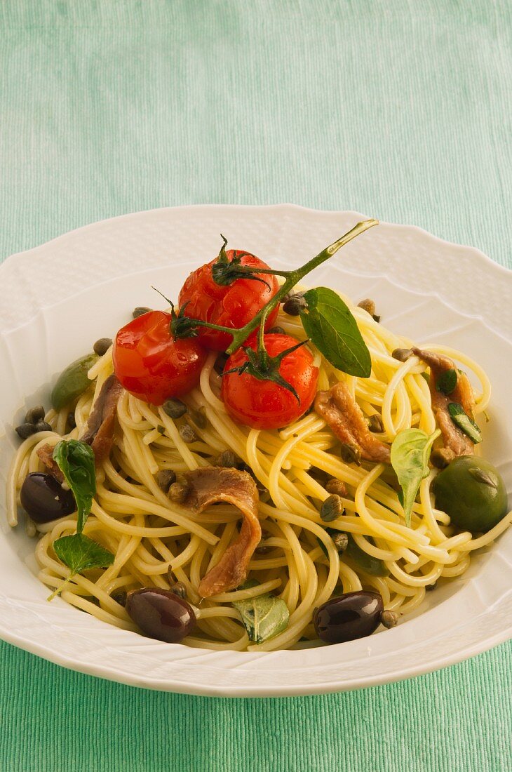 Spaghetti with anchovies, tomatoes and olives