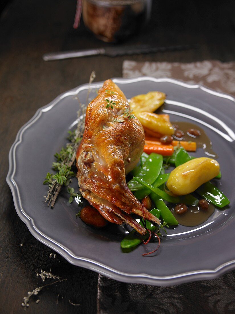 Rabbit with potatoes, sugar snap peas and carrots