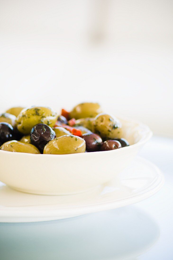 A bowl of various olives