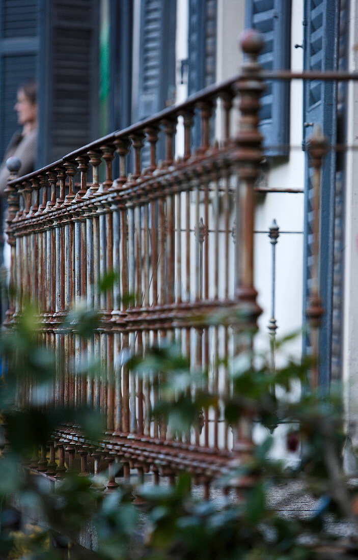 Rusty, traditional balcony balustrade in front of house