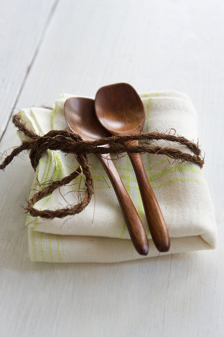 Wooden spoon on a kitchen towel