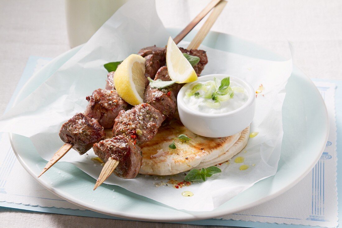 Souvlaki (Greek meat kebabs) with tzaziki and pita bread